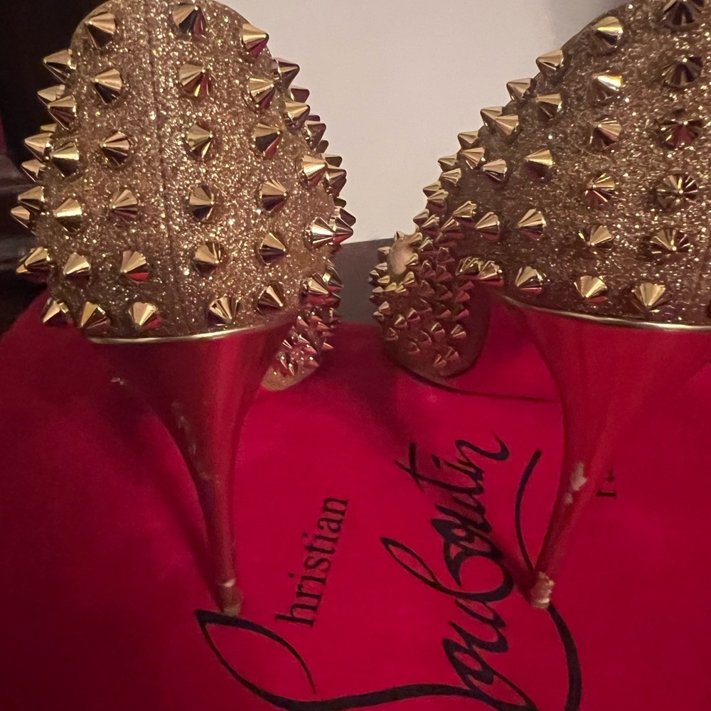 Gently worn gold spike Christian Louis Vuitton size 8 1/2